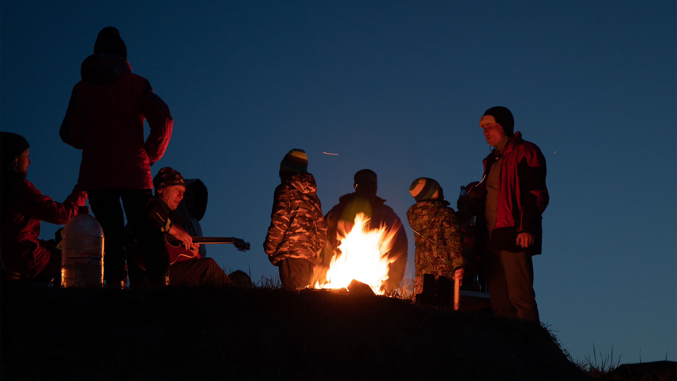 People warming around a fire