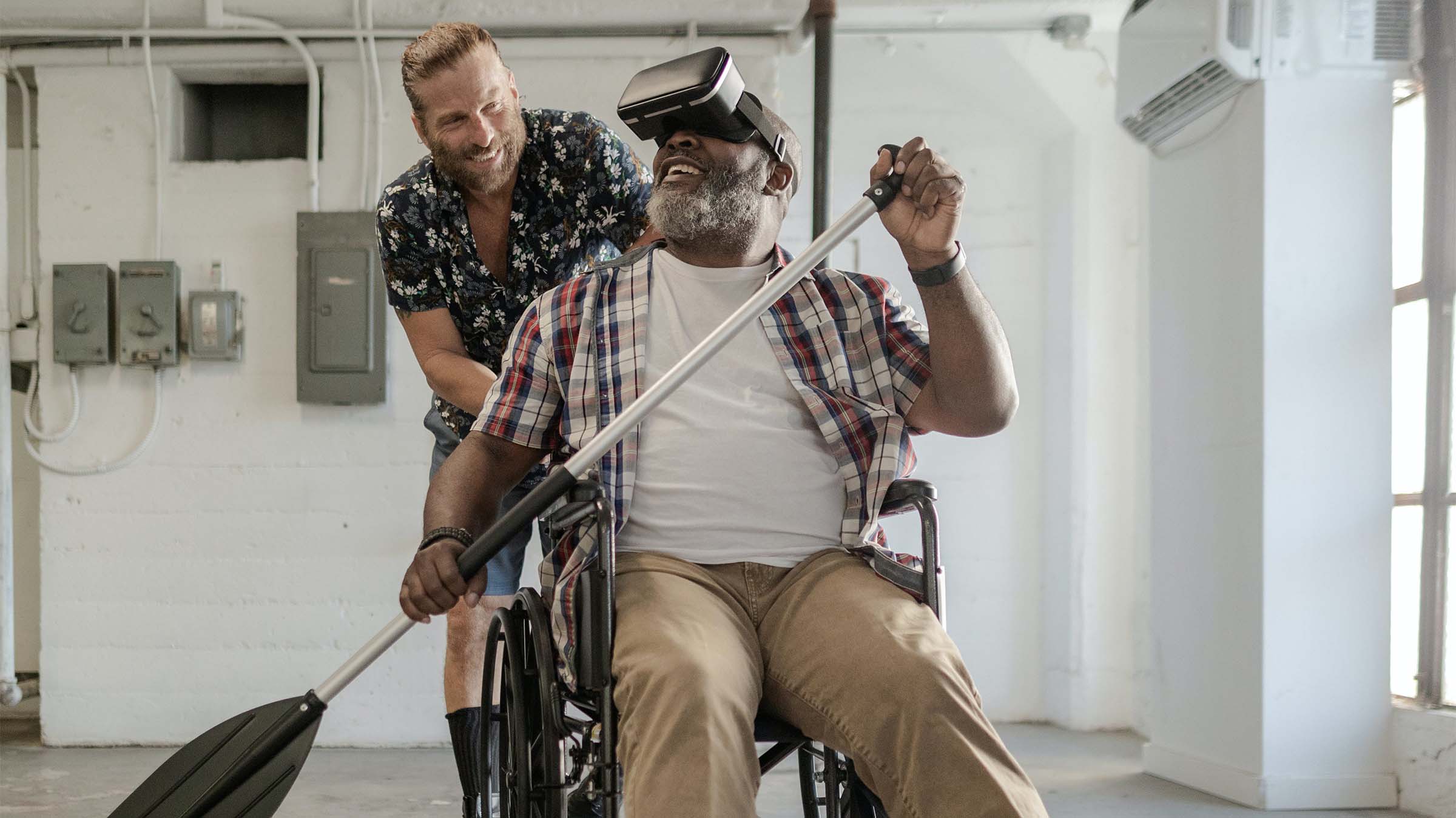 A man in a wheelchair experiencing canoeing with VR